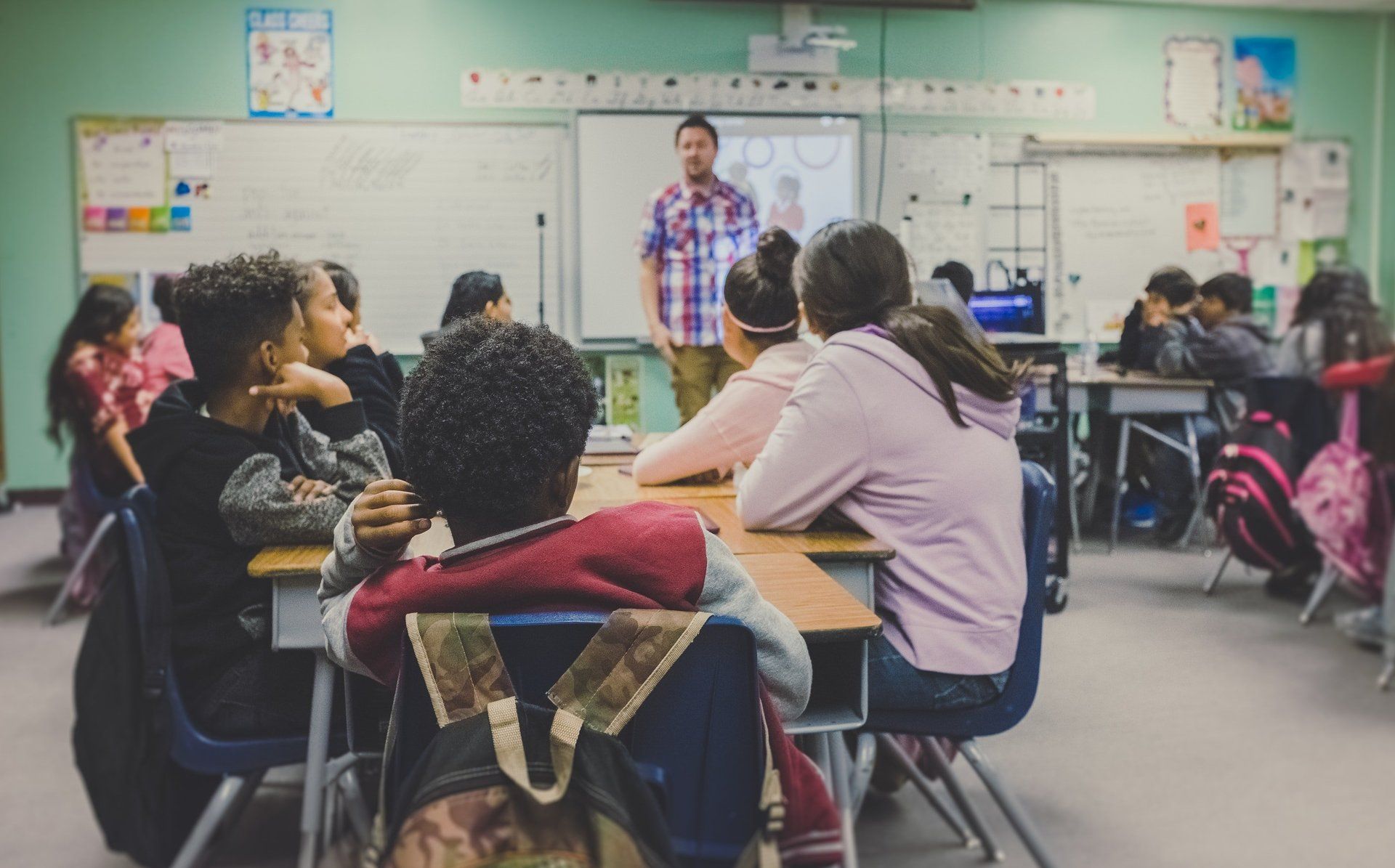 A teacher leading a classroom discussion with students
