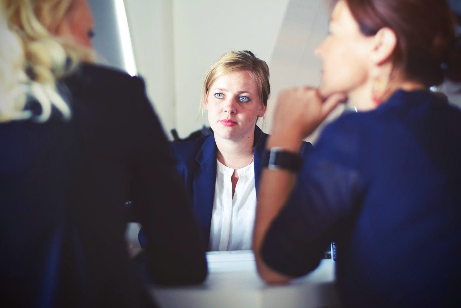 Colleagues exchanging candid feedback in a review meeting